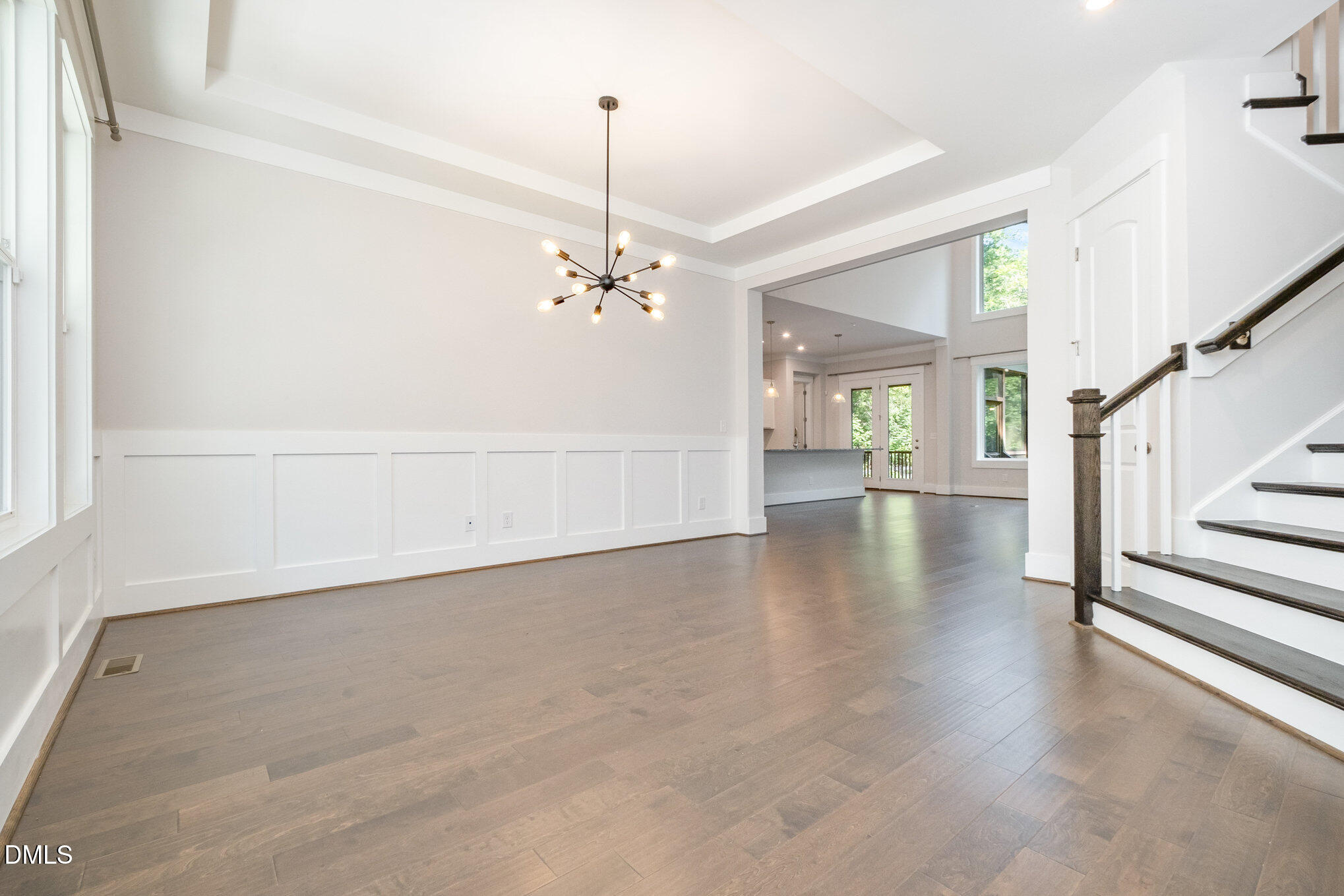 1017 Fortune Lane Mebane, NC 27302 - Photo 23 of 84 a view of an empty room with wooden floor and chandelier
