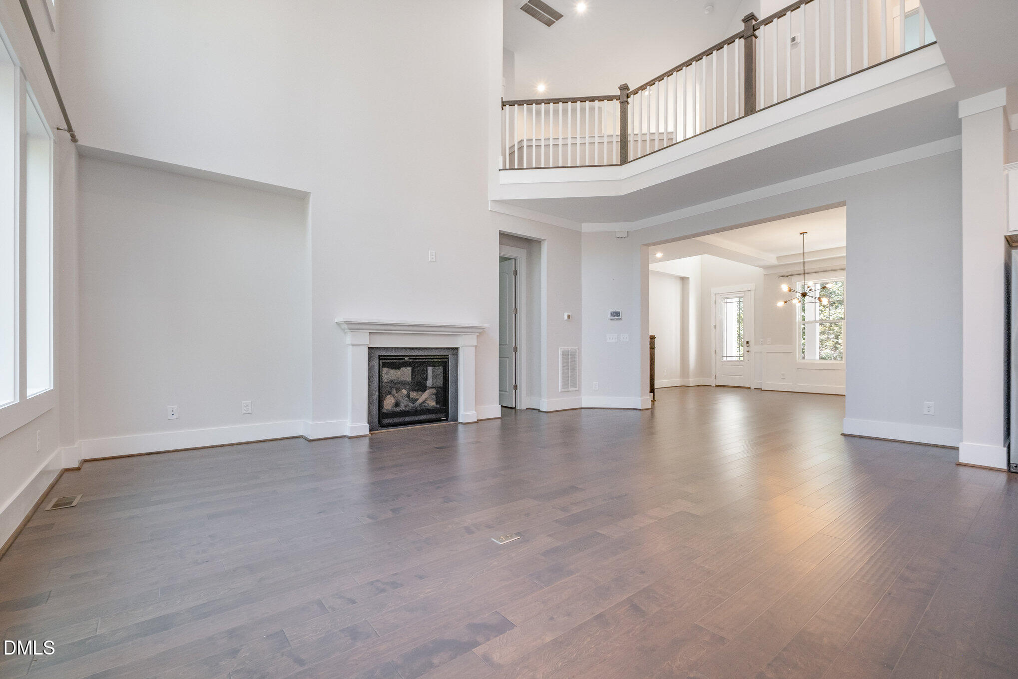 1017 Fortune Lane Mebane, NC 27302 - Photo 26 of 84 an empty room with wooden floor and a window
