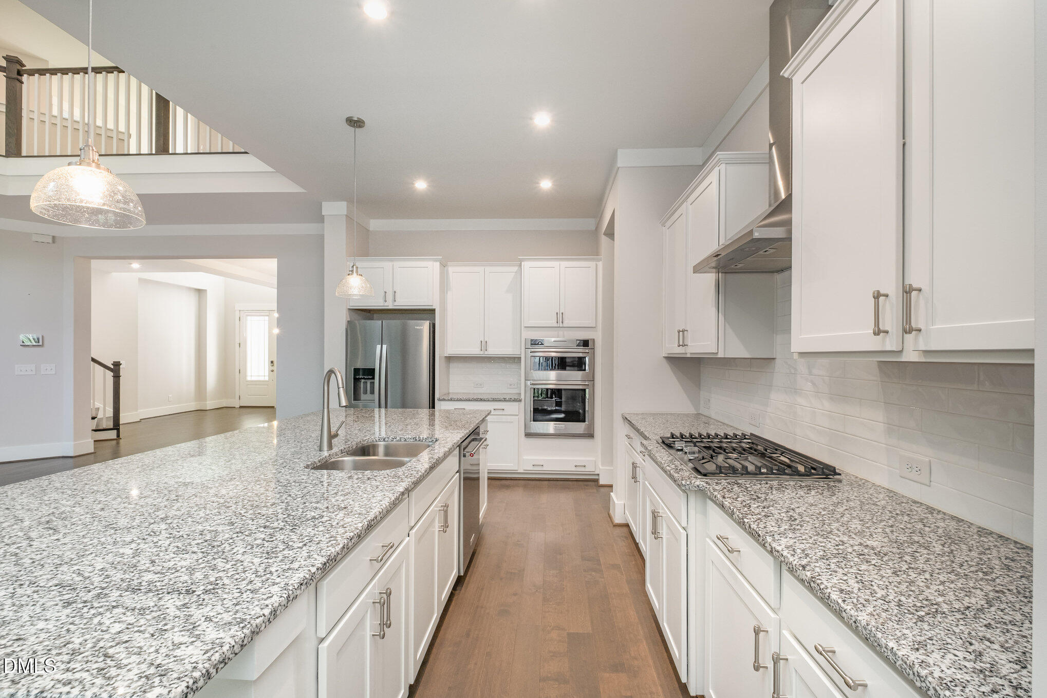 1017 Fortune Lane Mebane, NC 27302 - Photo 30 of 84 a large kitchen with kitchen island granite countertop a large counter top and stainless steel appliances