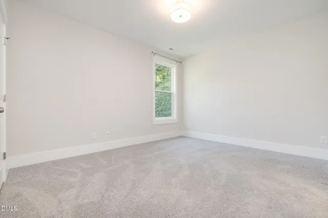 a house with swimming pool in front of it