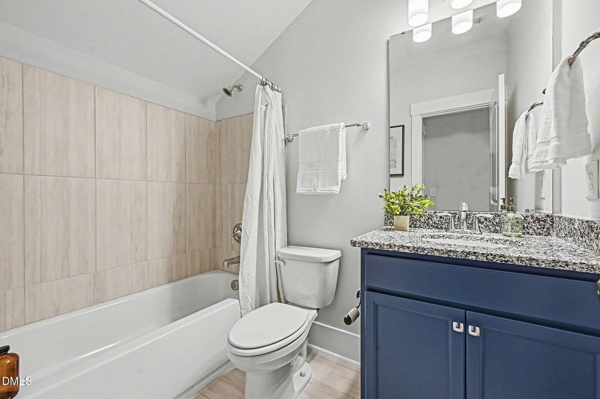 1017 Fortune Lane Mebane, NC 27302 - Photo 44 of 84 a bathroom with a granite countertop sink toilet and shower