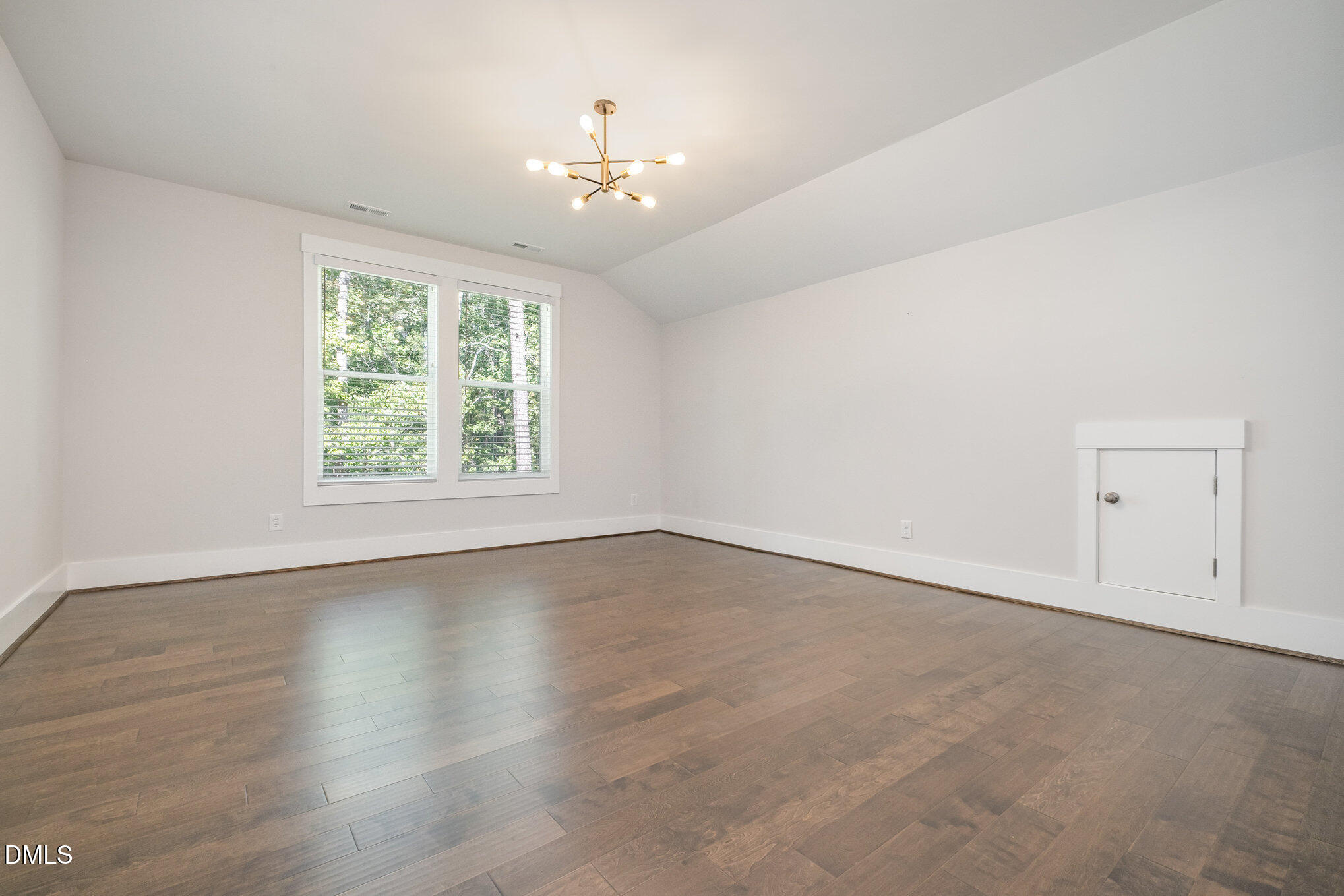 1017 Fortune Lane Mebane, NC 27302 - Photo 48 of 84 an empty room with wooden floor and windows