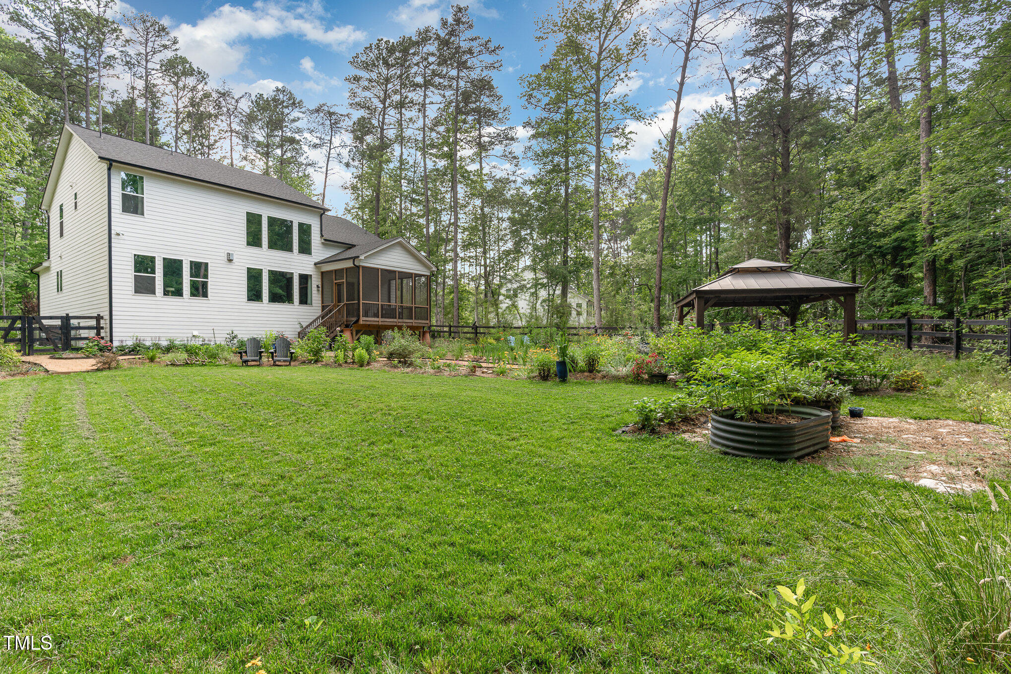 1017 Fortune Lane Mebane, NC 27302 - Photo 54 of 84 a front view of a house with a yard and trees