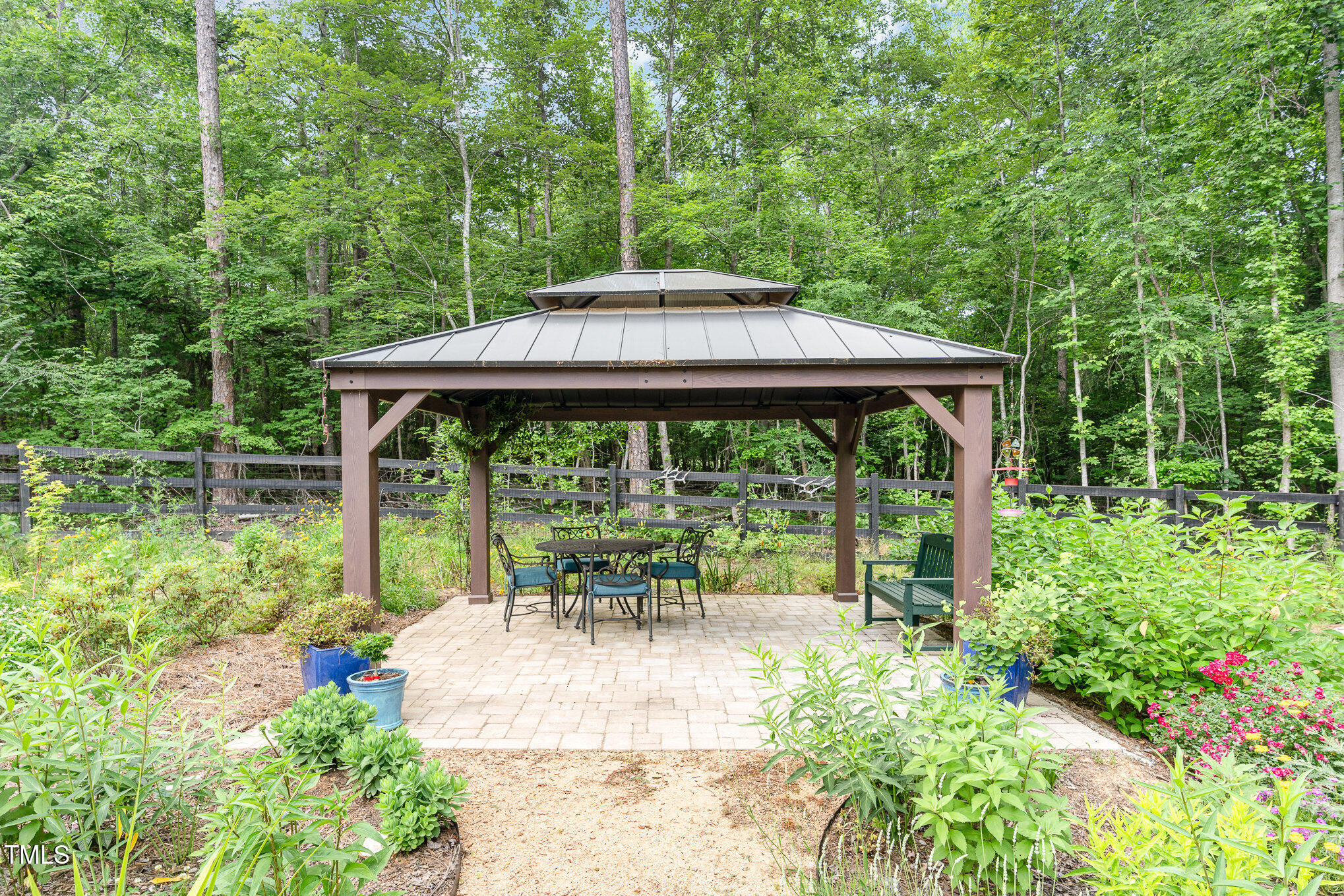 1017 Fortune Lane Mebane, NC 27302 - Photo 60 of 84 a view of backyard with table and chairs and potted plants