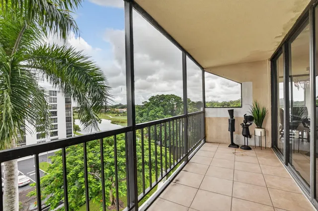 a kitchen with stainless steel appliances granite countertop a refrigerator stove microwave and sink