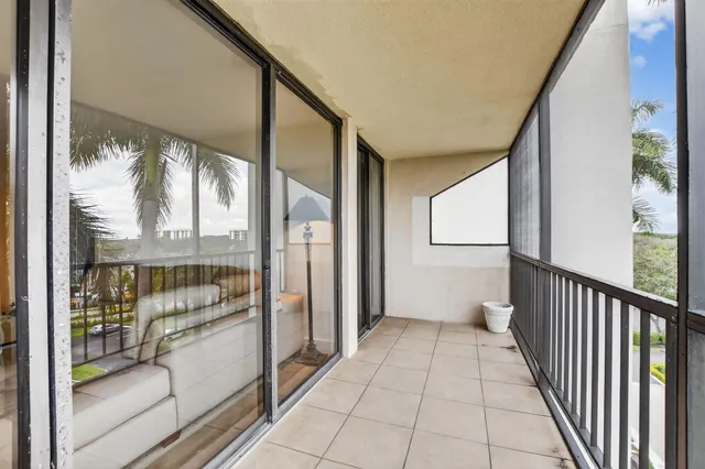 a kitchen with granite countertop a sink stainless steel appliances and cabinets