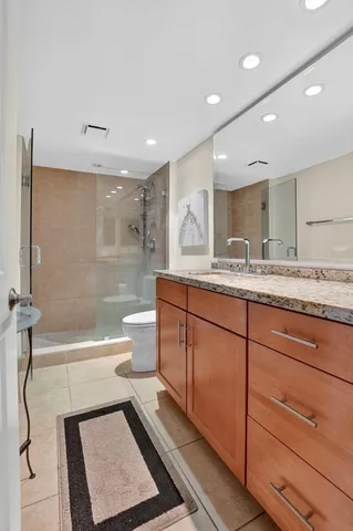 a living room with furniture and a dresser