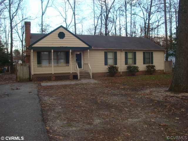 11011 Drayton Road Chester, VA 23831 - Photo 1 of 5 a front view of a house with garden