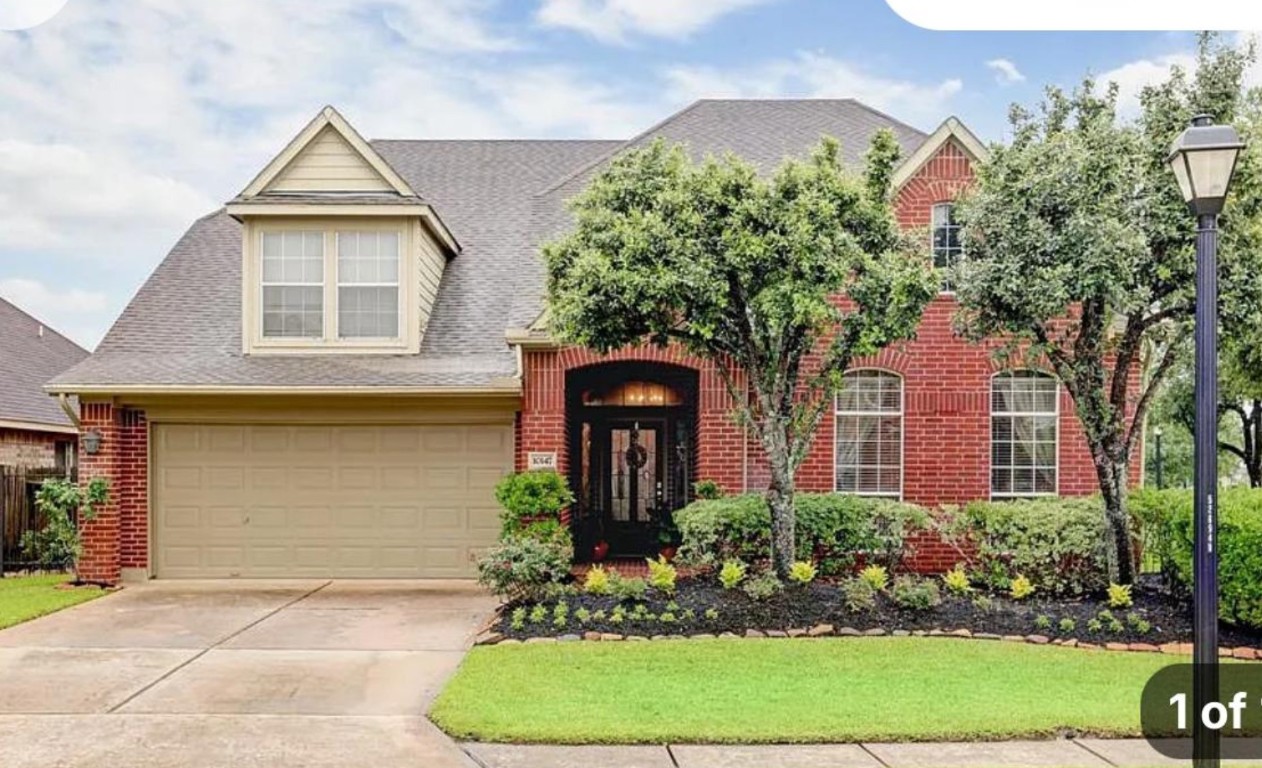 10147 Lazy Lagoon Houston, TX 77065 - Photo 2 of 15 front view of a house with a yard
