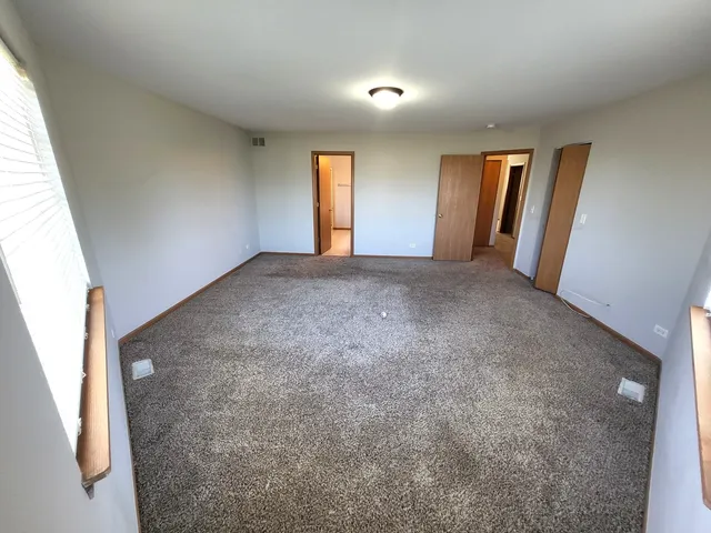 a view of an empty room and window