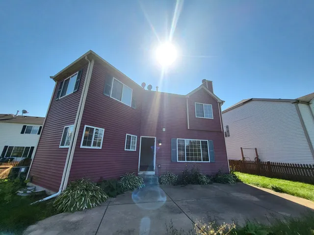 a view of a building with a yard