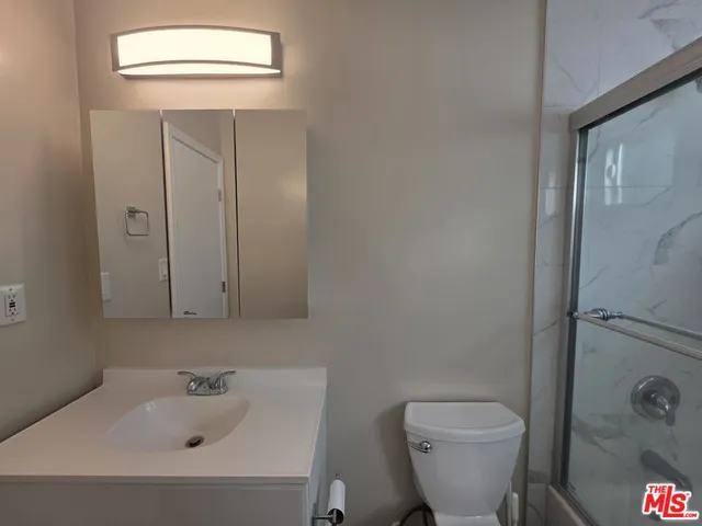 a view of hallway with wooden floor