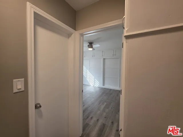 a view of room with window and ceiling fan