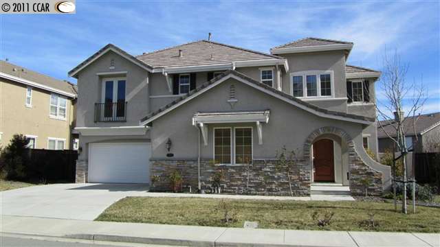 5267 Crystyl Ranch Drive Concord, CA 94521 - Photo 1 of 1 a front view of a house with a yard