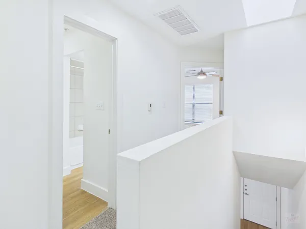 a hallway with cabinet