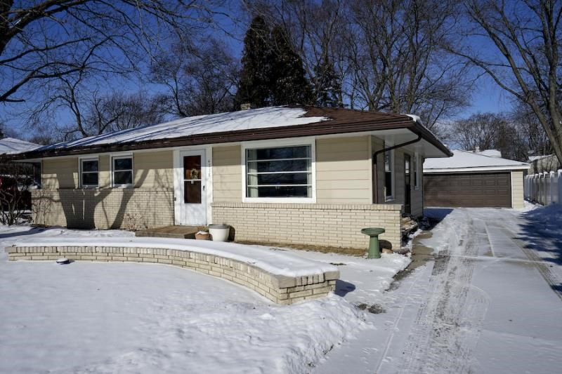 4718 Mohawk Road Rockford, IL 61107 - Photo 1 of 25 a front view of a house with garden