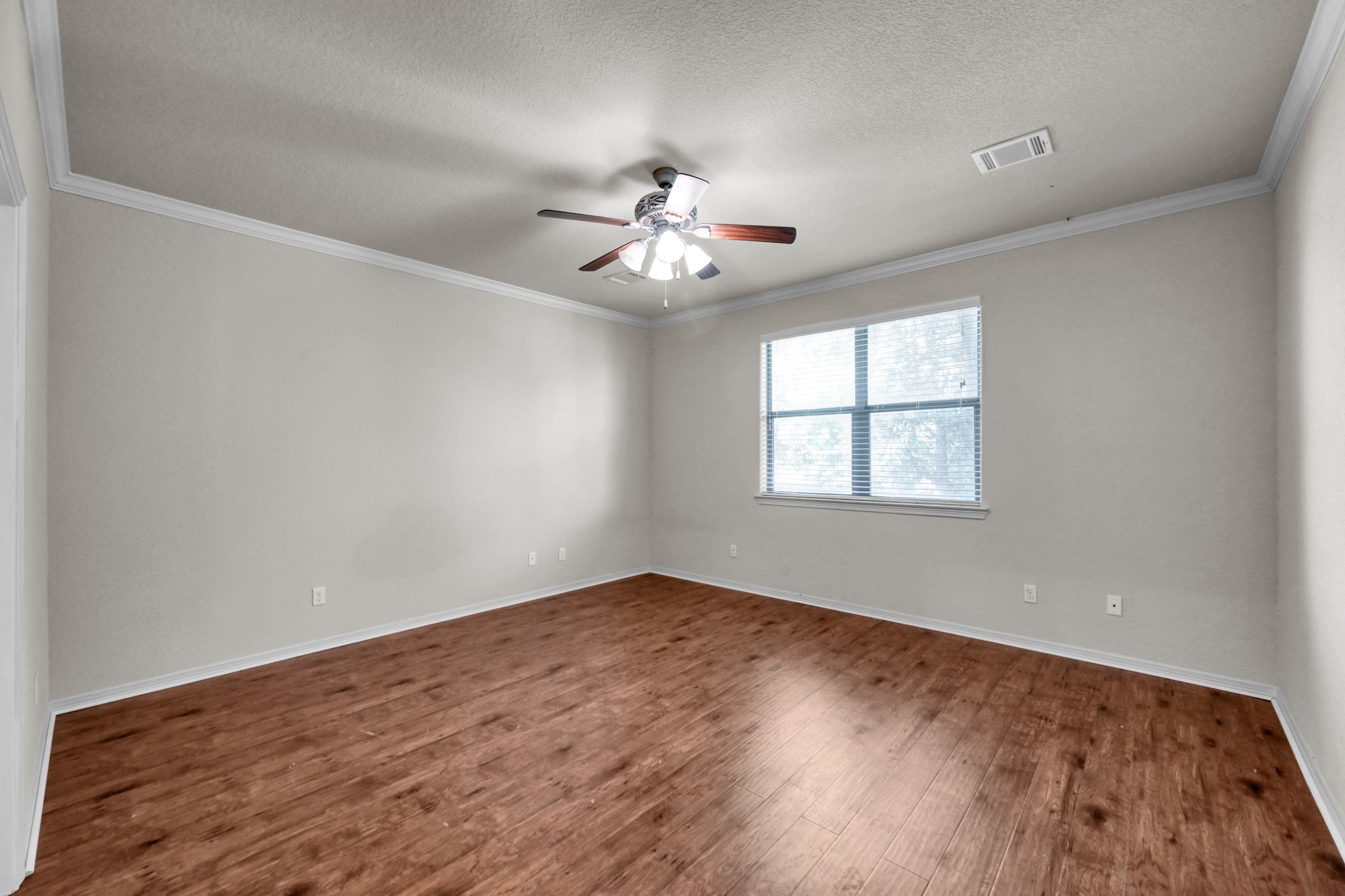 130 April Cove Conroe, TX 77356 - Photo 20 of 36 wooden floor in an empty room with a window