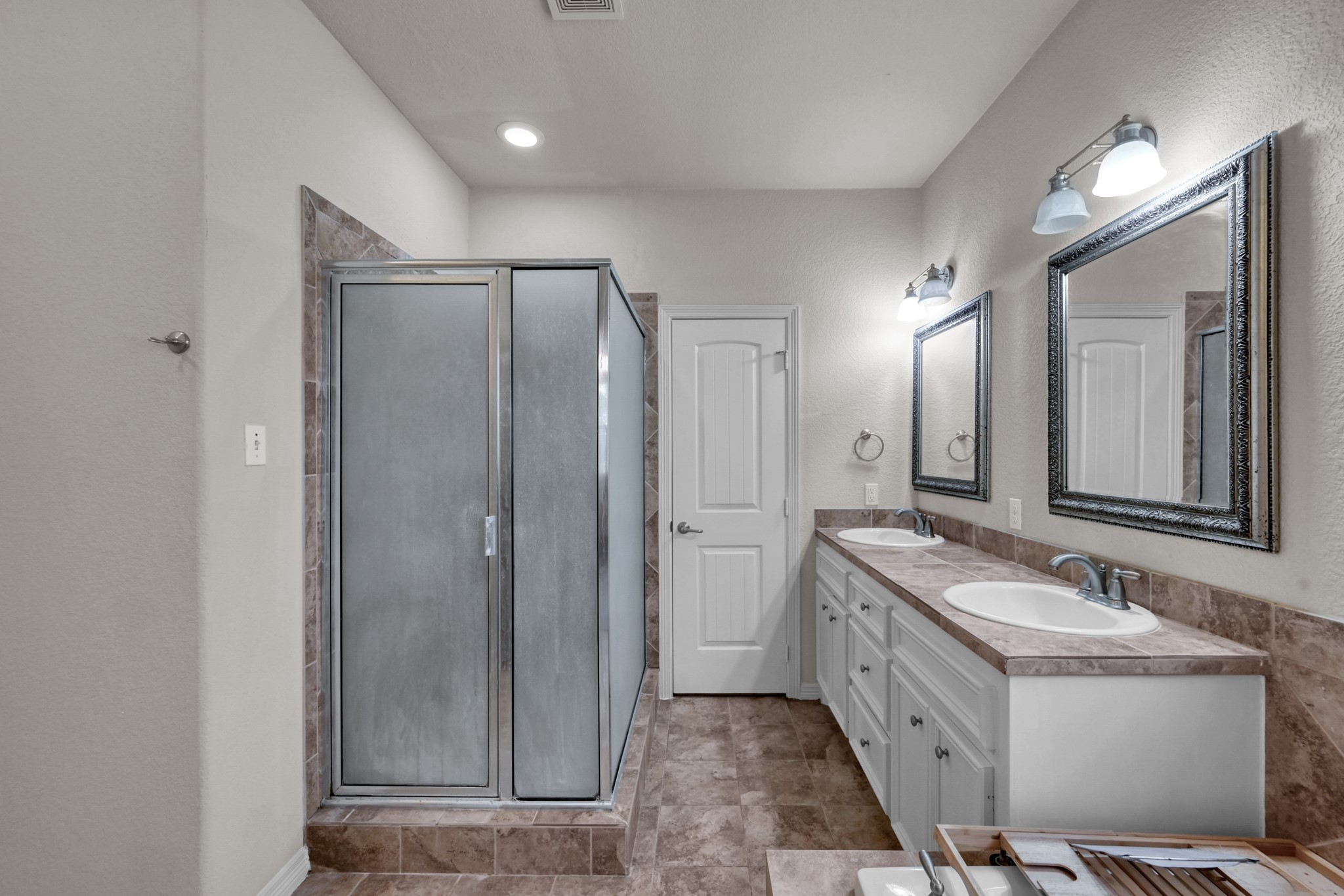 130 April Cove Conroe, TX 77356 - Photo 23 of 36 a bathroom with a double vanity sink mirror and shower
