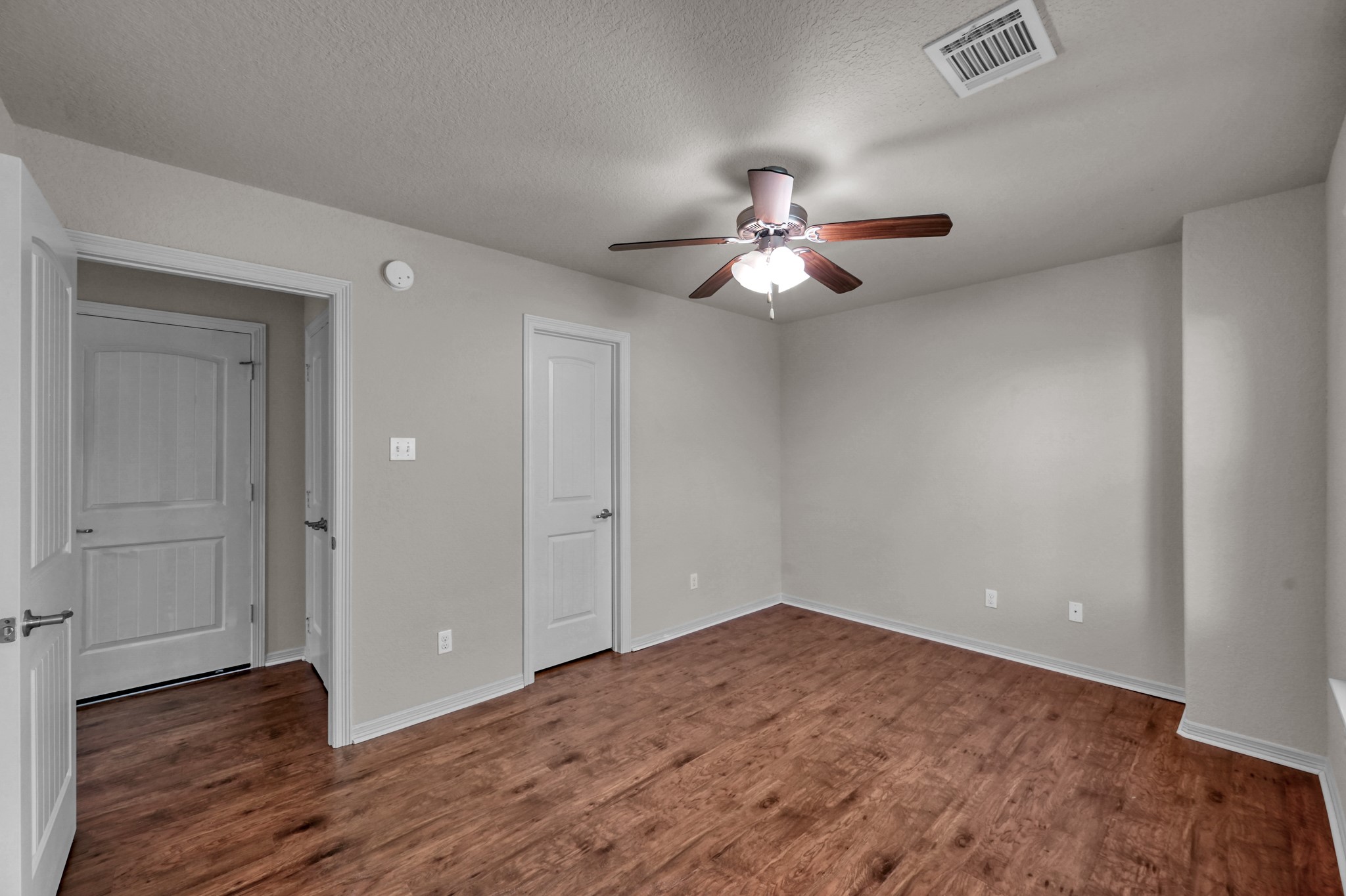 130 April Cove Conroe, TX 77356 - Photo 28 of 36 wooden floor in an empty room with a window