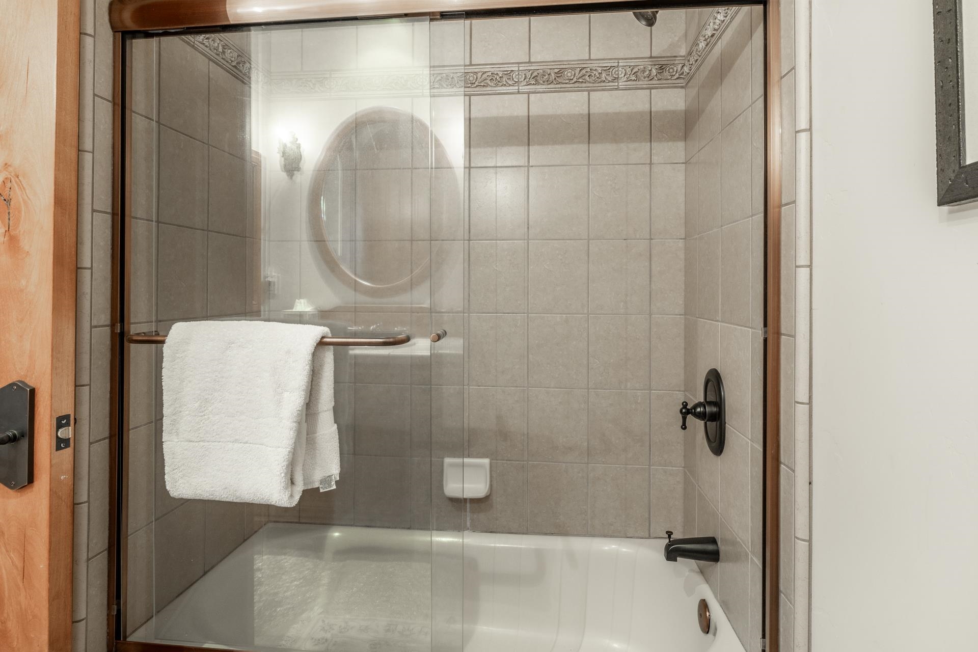 45 Skyline Road June Lake, CA 93529 - Photo 34 of 58 a bathroom with a glass shower door
