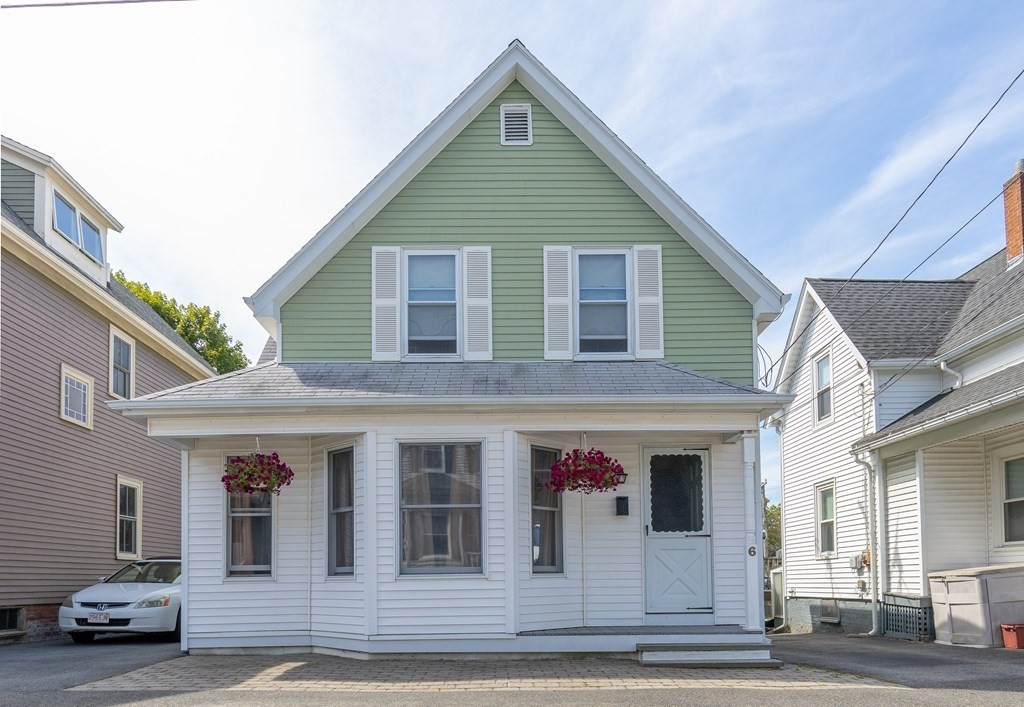 6 Harvard Street Gloucester, MA 01930 - Photo 1 of 19 a front view of a house with a garage