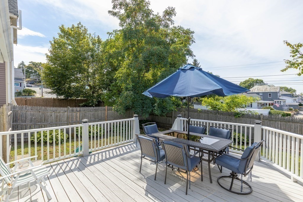 6 Harvard Street Gloucester, MA 01930 - Photo 14 of 19 a view of a wooden bench on the roof deck