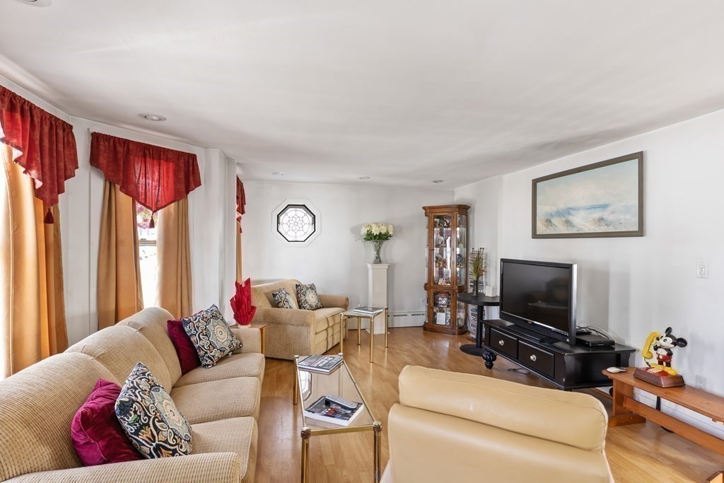 6 Harvard Street Gloucester, MA 01930 - Photo 3 of 19 a living room with furniture and a flat screen tv