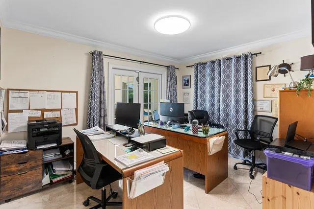 a view of a workspace with furniture