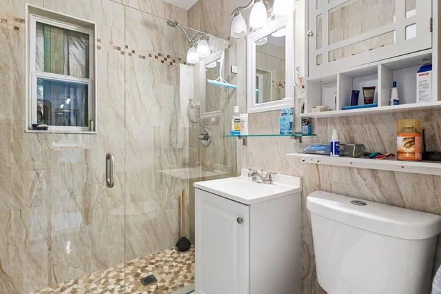 a bathroom with a sink and a shower curtain