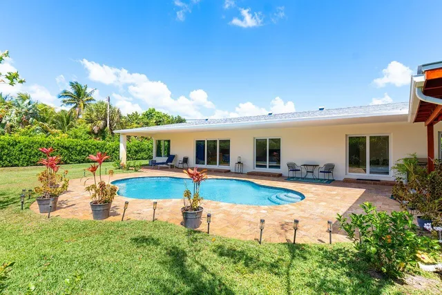 swimming pool view with seating space