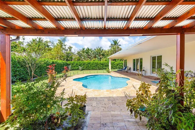 an outdoor view of house with swimming pool