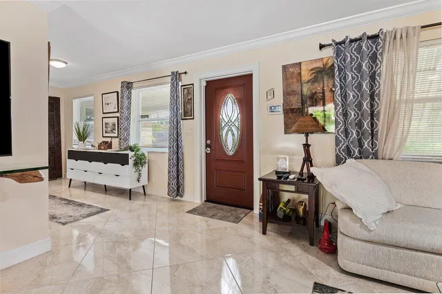 a living room with furniture and a table