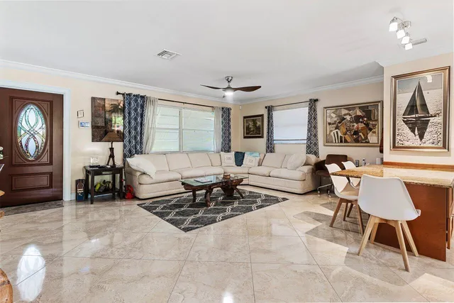 a living room with furniture and a window