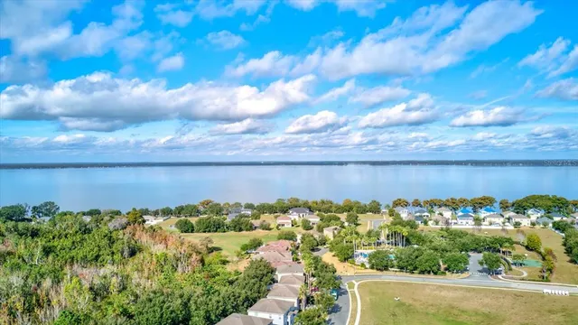 a view of a lake with a building in the back