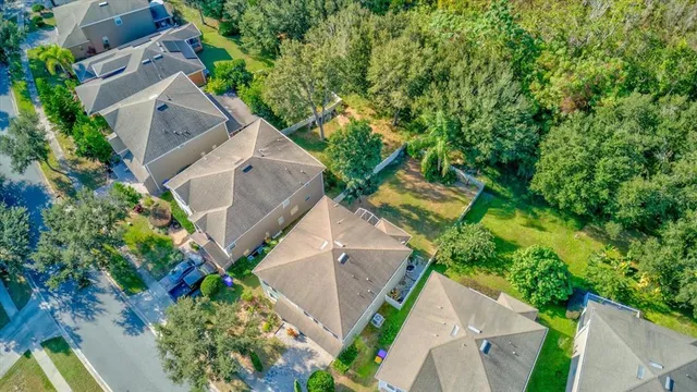 an aerial view of a house with garden space and street view