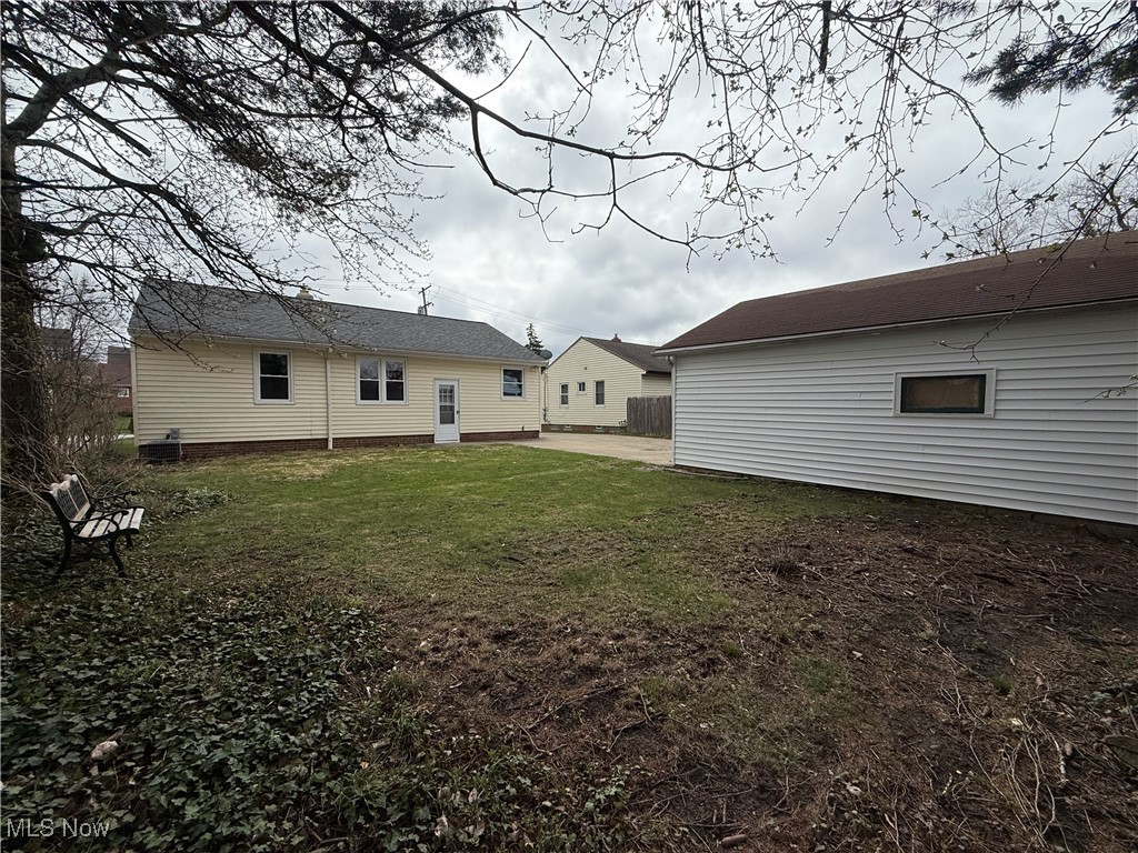 9417 Alexander Road Garfield Heights, OH 44125 - Photo 3 of 38 Rear view of house with a yard