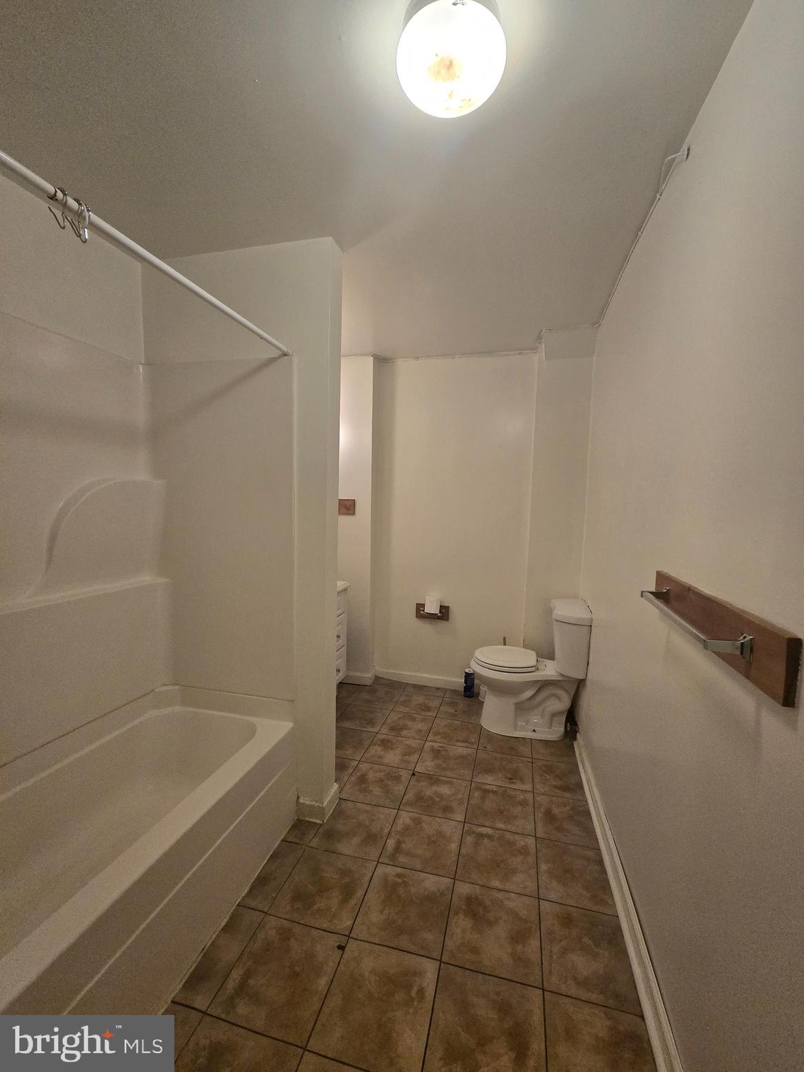 1304 Walnut Street, Unit 2 Philadelphia, PA 19107 - Photo 15 of 33 a bathroom with a bathtub and a toilet