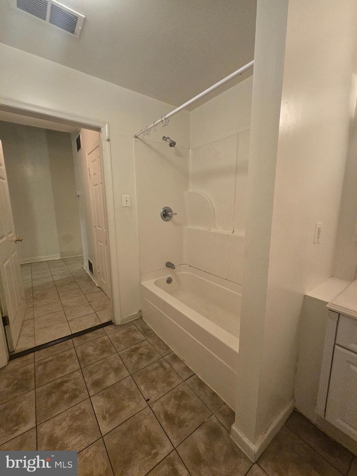 1304 Walnut Street, Unit 2 Philadelphia, PA 19107 - Photo 17 of 33 a bathroom with a glass shower door