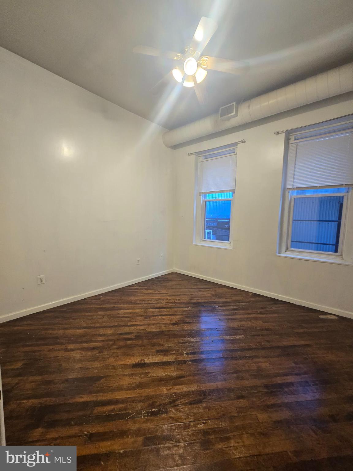 1304 Walnut Street, Unit 2 Philadelphia, PA 19107 - Photo 23 of 33 a view of empty room with wooden floor and fan