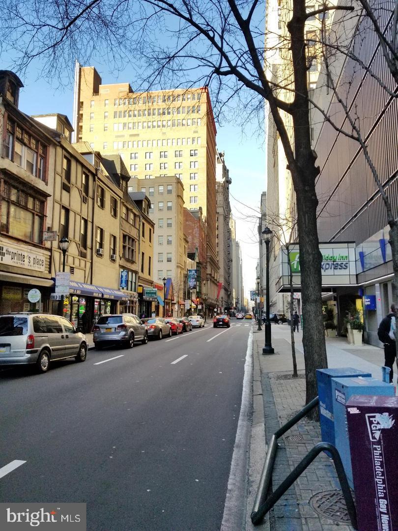 1304 Walnut Street, Unit 2 Philadelphia, PA 19107 - Photo 3 of 33 a city street lined with buildings and cars