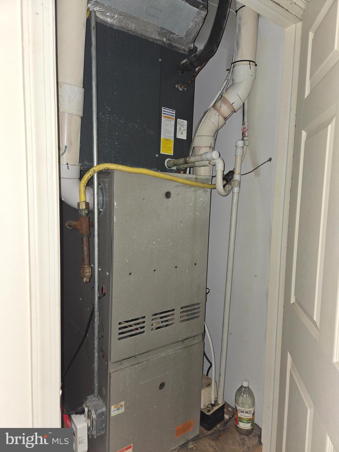 1304 Walnut Street, Unit 2 Philadelphia, PA 19107 - Photo 31 of 33 a room with water heater and a cabinet