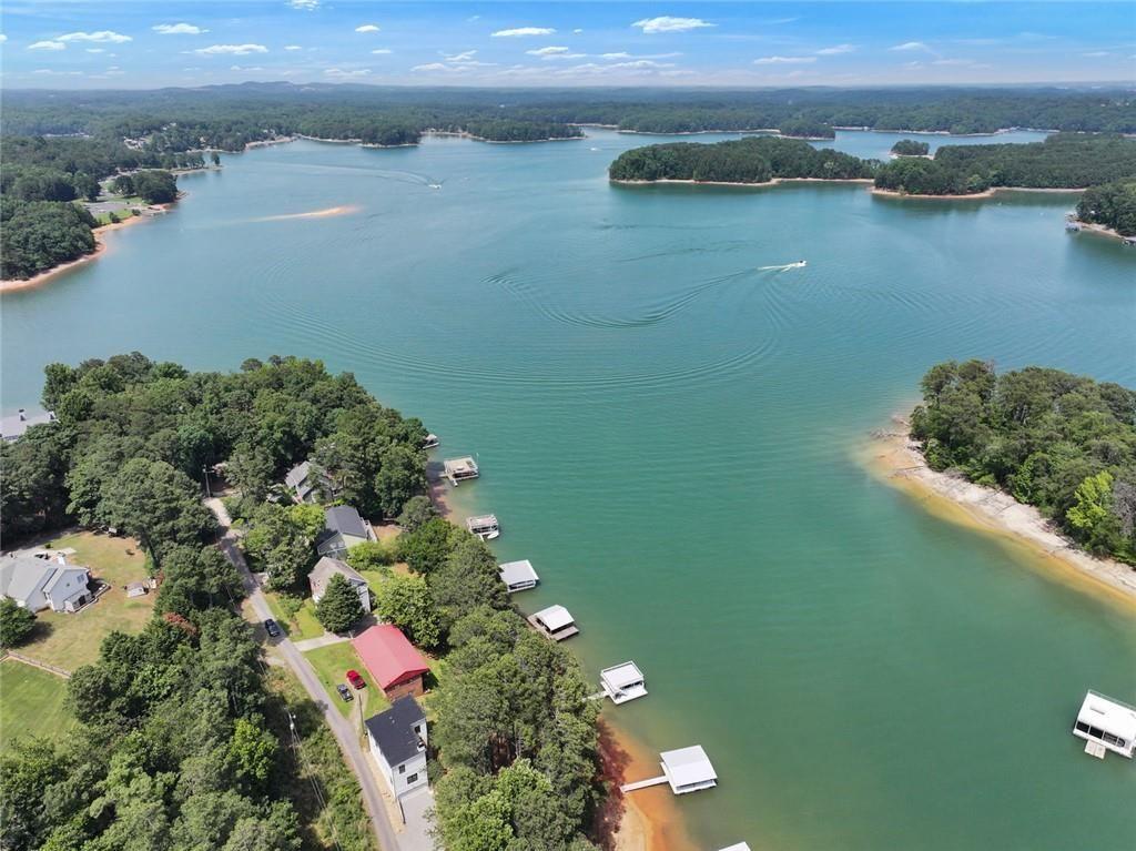 2040 Ridge Road Cumming, GA 30041 - Photo 6 of 52 an aerial view of lake and residential houses with outdoor space
