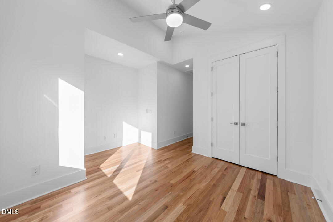 2530 West Wilson Street Durham, NC 27705 - Photo 31 of 49 a view of livingroom with hardwood floor and ceiling fan