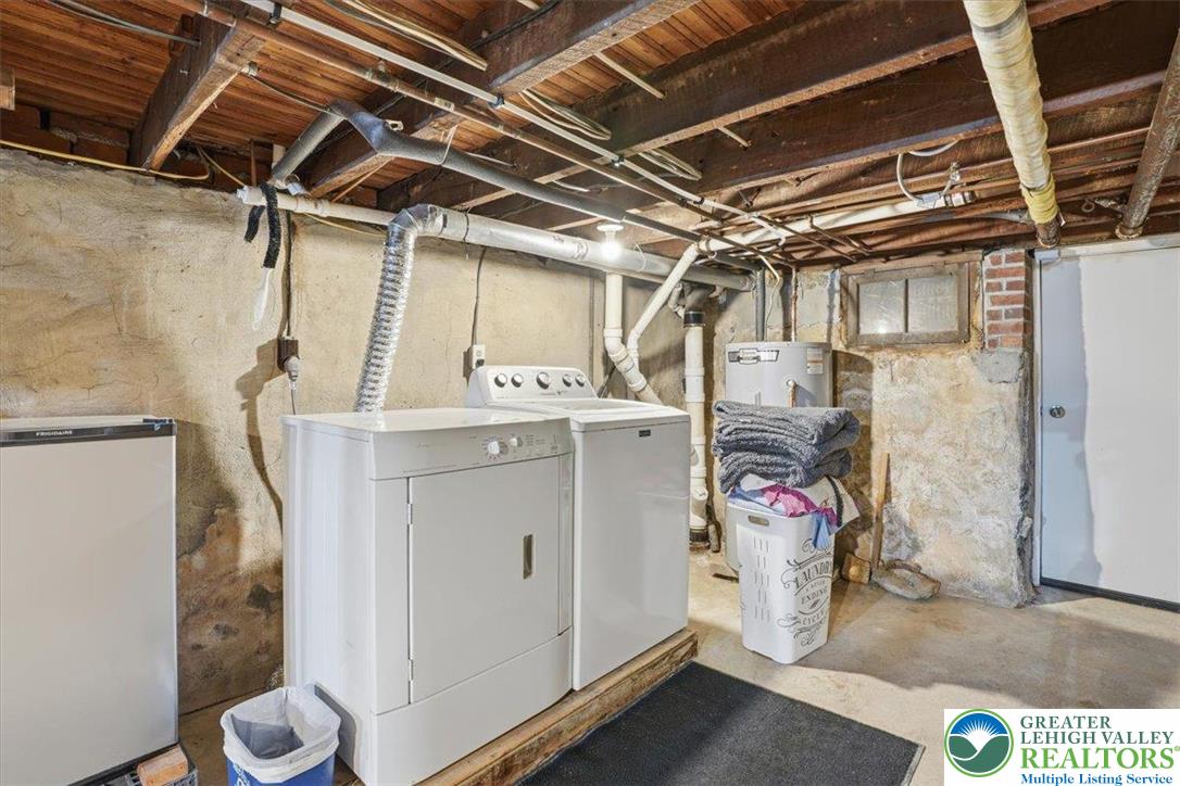 525 Ridge Street Emmaus, PA 18049 - Photo 60 of 68 This basement offers practical utility space, complete with laundry facilities and ample storage.