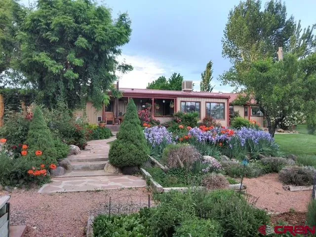 a view of a backyard with sitting area