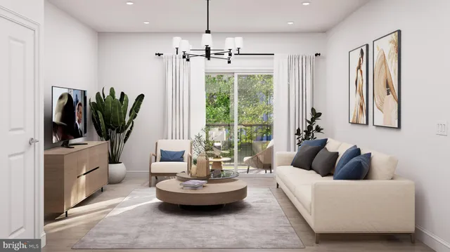 a living room with furniture potted plant a window and a flat screen tv