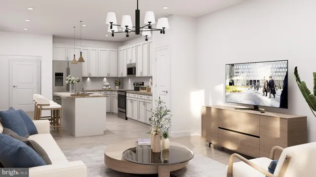 a living room with furniture and a chandelier