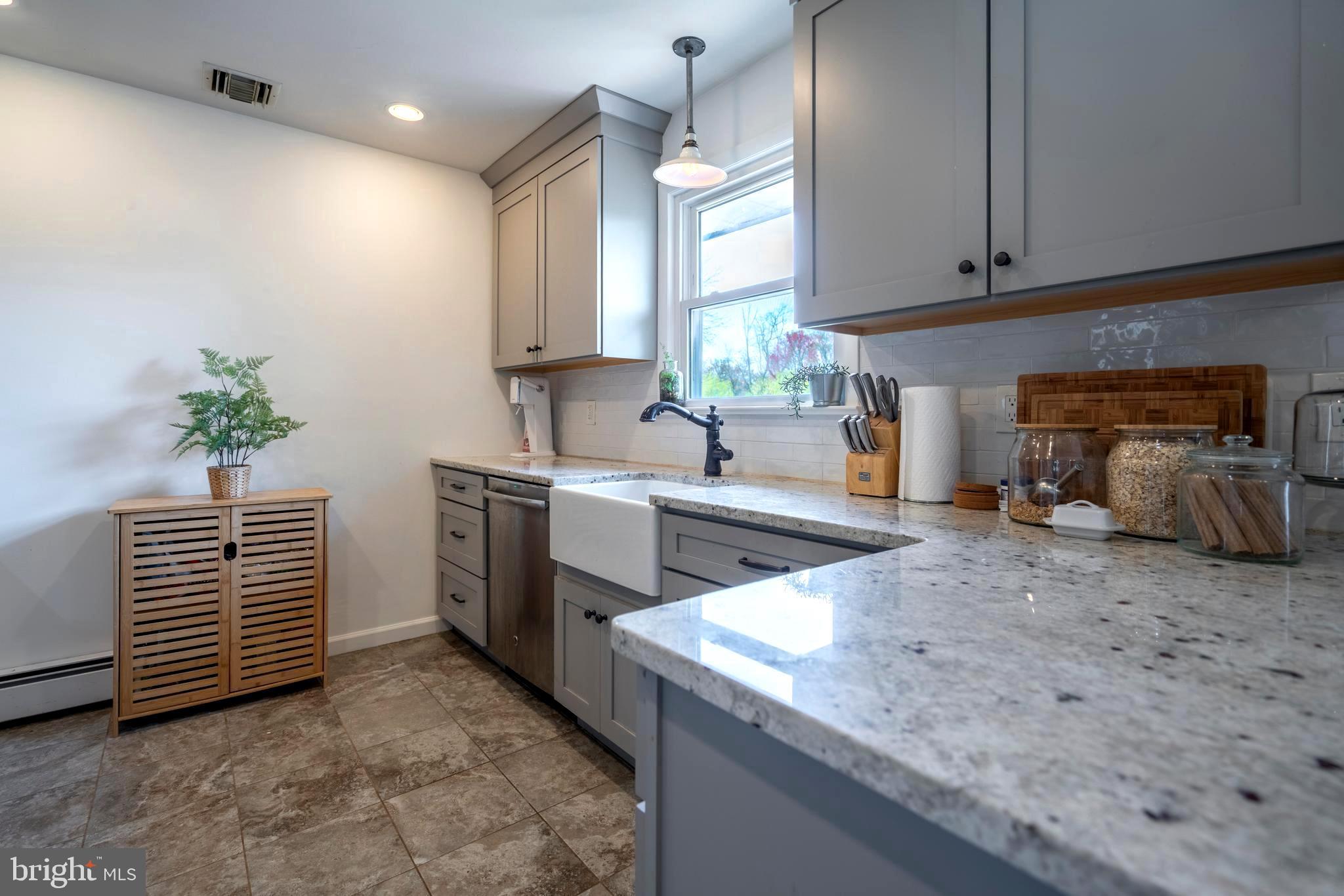 1066 Almshouse Road Ivyland, PA 18974 - Photo 11 of 39 a kitchen that has a sink and a stove in it