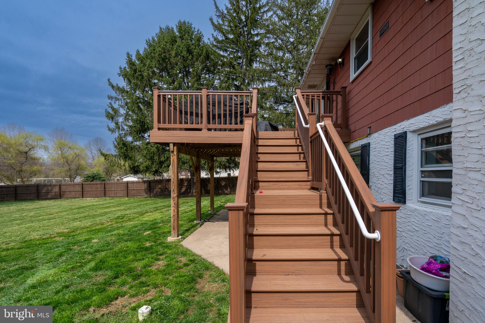 1066 Almshouse Road Ivyland, PA 18974 - Photo 19 of 39 a view of backyard with deck and a garden