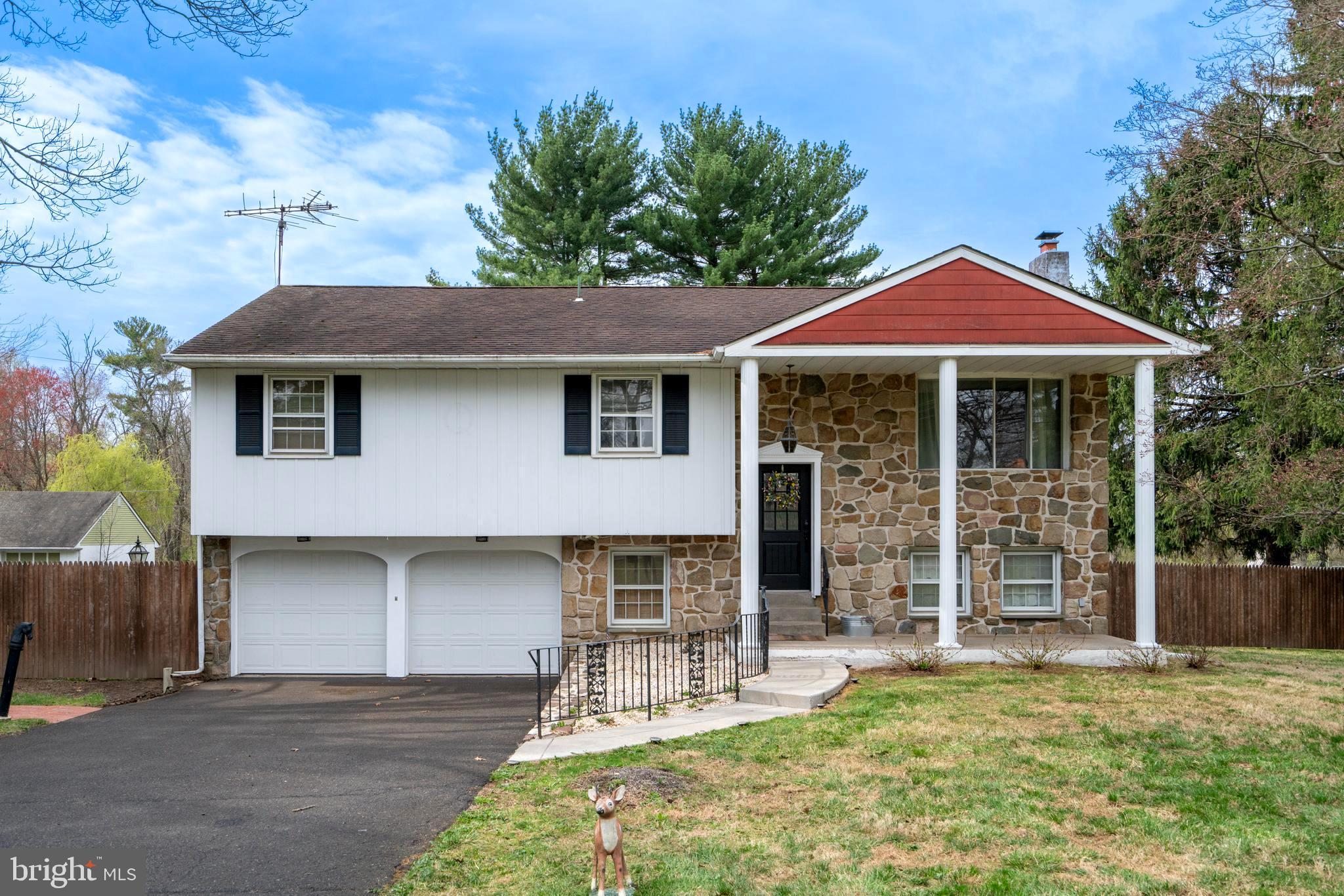 1066 Almshouse Road Ivyland, PA 18974 - Photo 2 of 39 a front view of a house with yard and porch